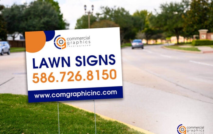 Lawn Sign in Orange and Purple Signage on Intersection